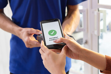 Woman Using  Phone Payment to Transfer Money to Shop Seller