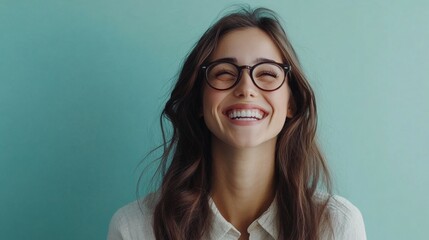 Confident Young Businesswoman Smiling: Professional Female Executive with Glasses Looking at Copy Space. Optimistic Career Woman Radiating Success and Opportunity. Perfect for Corporate Advertising, J
