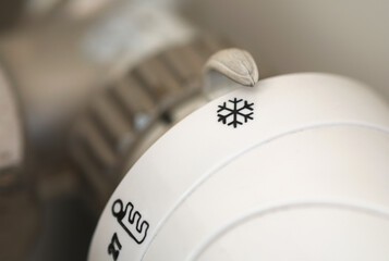 thermostat control knob set to cold icon 
