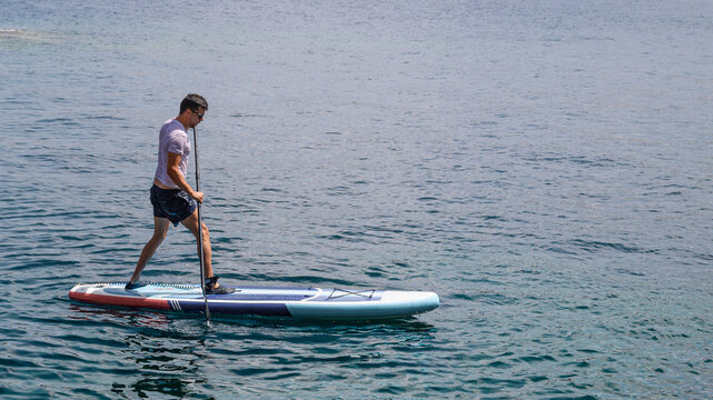 sup day padel surf mediterranean sea men at ibiza