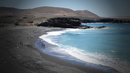 Rough coast and black sand beach