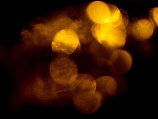 Light orange warm color light leak on dark background for design use and special effects. Abstract...