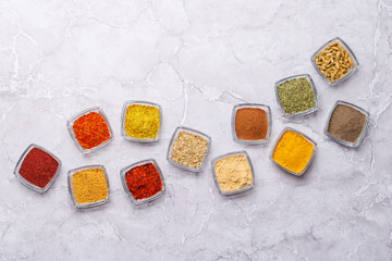 A vibrant assortment of various spices and herbs displayed together