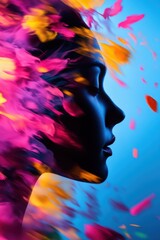 Fototapeta premium A captivating silhouette of a woman with vibrant floral petals swirling around her, symbolizing beauty and transformation.