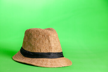 straw hat on green background. Straw hat concept. Vintage concept. space for text.