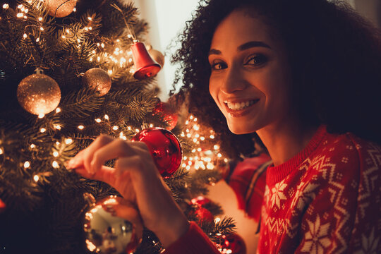 Photo of nice young girl decorate tree cheerful smile wear ornament clothes enjoy cozy christmas decoration interior flat indoors