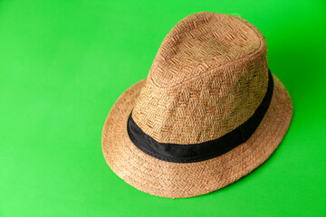 straw hat on green background. Straw hat concept. Vintage concept. space for text.