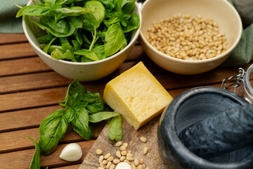 Top View of Pesto Making: Fresh Basil, Pine Nuts, Garlic, and Parmesan
