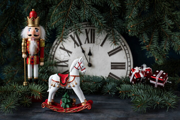 Christmas horse , Nutcracker toy soldier with  clock, selective focus