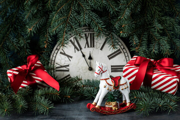 Christmas greeting card with horse toy and holiday  gift boxes
