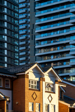 The image features a mix of traditional and modern architectural buildings illuminated by sunlight, showing the contrast and harmony of different eras in an urban setting in London