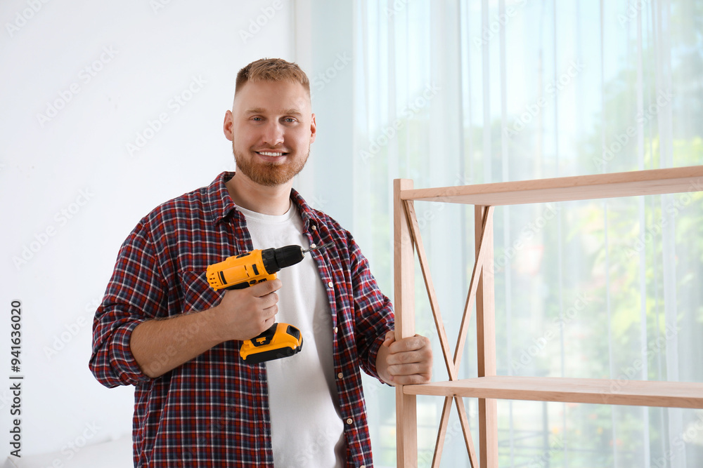 Sticker Man with electric screwdriver at home. Assembling furniture