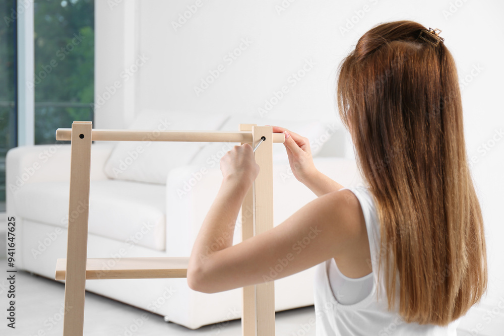 Sticker Woman with screwdriver assembling furniture at home