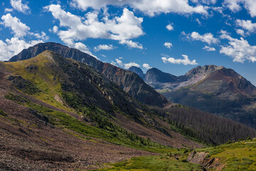 Mountain peaks and valley in the early summer morning