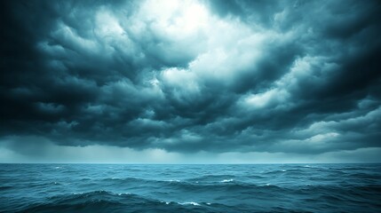 Obraz premium A dramatic seascape with dark, ominous clouds looming over a turbulent ocean, capturing the raw power and intensity of an approaching storm.