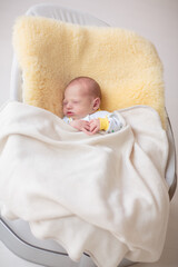 Little baby on white bed