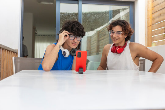 Gay couple sharing a lighthearted moment at home