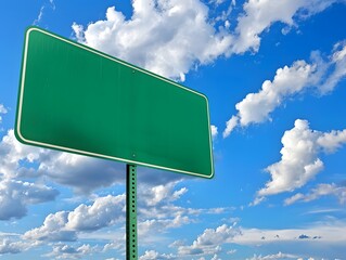 Blank green road sign against a vibrant blue sky