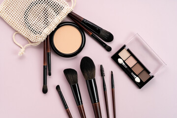 Top view of professional makeup brushes and cosmetics set