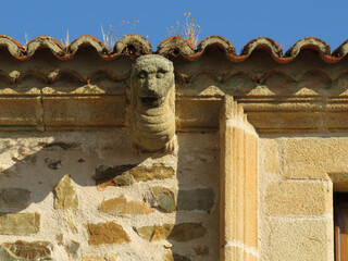 Medieval architecture in Caceres. Spain. Detail of cornice decorated with an monstruous animal as corbel.  © JOSEANTONIO
