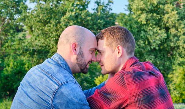 Affectionate Gay Couple Enjoying a Romantic Moment Outdoors