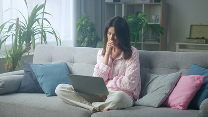 Fototapeta premium Woman feeling worried while working at home on