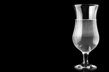 Hurricane glass filled with water.