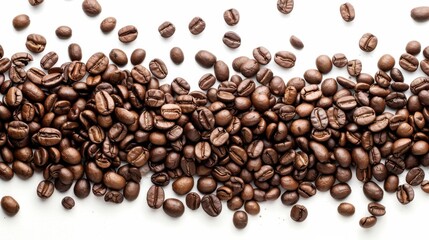 Roasted coffee beans spilling on white background with copy space