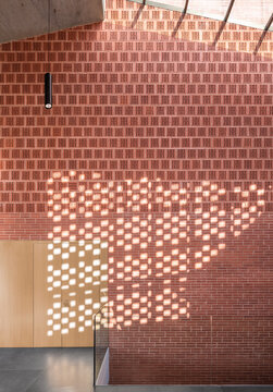 Modern auditorium interior with perforated brick wall design