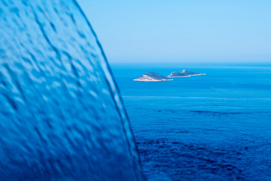 Infinity pool with fountain and small islands in the horizon - Kalkan Antalya TURKEY