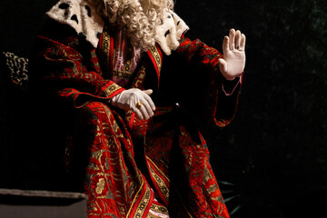 One of the Three Wise Men in elaborate Christmas costumes