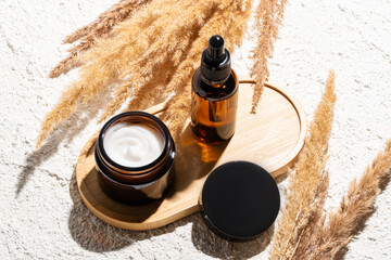 Natural skincare products displayed with pampas grass