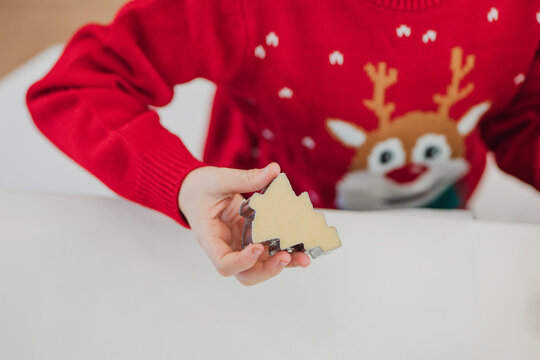 Child baking with a festive theme for Christmas