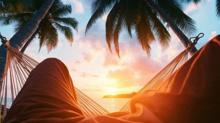 View from a hammock on a tropical beach during sunset, framed by palm trees and a vibrant sky, evoking relaxation and peace..