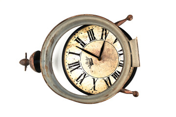 Broken old analog clock with glass and metal frame on wooden table, broken structure isolated on...