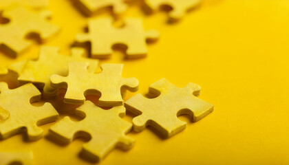 Fototapeta premium Group of yellow puzzle jigsaw pieces. Business, connection and interaction