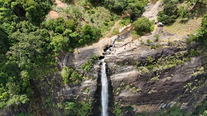 Obraz premium Waterfall in the jungle with natural pools on top. Drone view. Diyaluma Waterfall, Sri Lanka.
