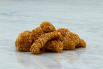 Homemade pork rinds or chicharrones carnudos in Spanish, easy to make in a kitchen pan. They are crunchy, meaty and delicious.