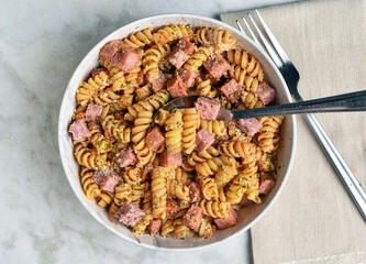 rotini  pasta with  diced spam  and seasoning