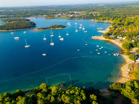 aerial view of islands near the town of Vrsar, Istria peninsula, Croatia. Tourist boats off the coast with crystal turquoise water