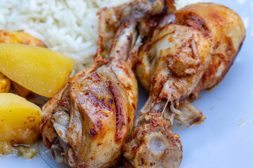 oven-fried chicken legs, french fries and rice pilaf.