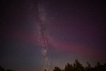 Night sky containing the Milky Way, the SAR arcs (Stable Auroral Red arcs) and the perseid shower