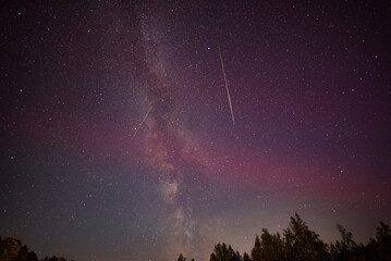 Night sky containing the Milky Way, the SAR arcs (Stable Auroral Red arcs) and the perseid shower