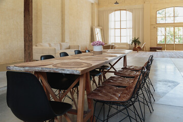 Rustic dining room complemented with Bertoia Wire Chairs.