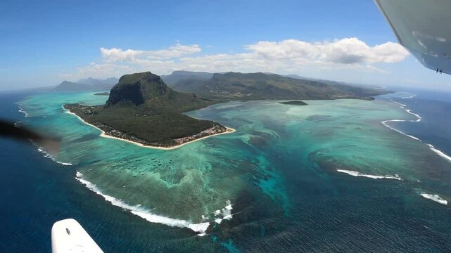 Underwater waterfall illusion view from the plane on the island of Mauritius