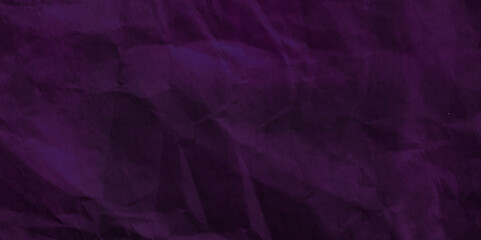 Purple crumpled paper texture in low light background. Silk cloth texture. Fabric pattern. crumpled kraft paper. A crumpled sheet of dark pink and purple paper abstract background. old paper texture. 