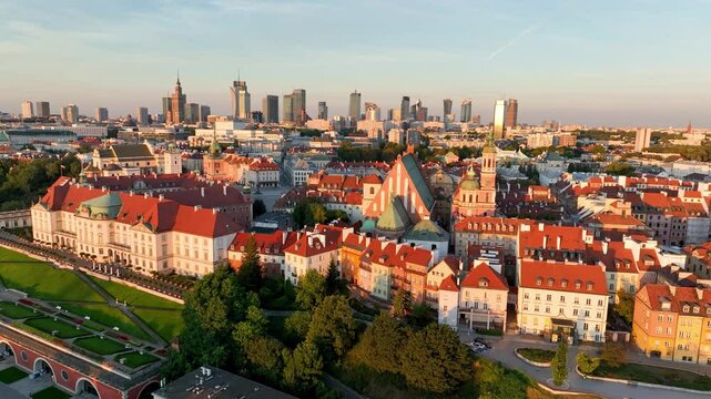 Aerial view of the Warszawa cityscape. Old town and modern skyscrapers at sunrise, Royal Castle. Poland.