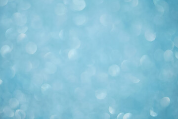 Abstract blue festive christmas background with bokeh.