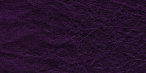 Purple crumpled paper texture in low light background. Silk cloth texture. Fabric pattern. crumpled kraft paper. A crumpled sheet of dark pink and purple paper abstract background. old paper texture. 