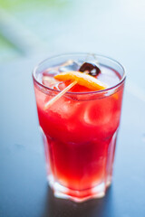 Sex on the Beach cocktail with slice of orange and a cherry